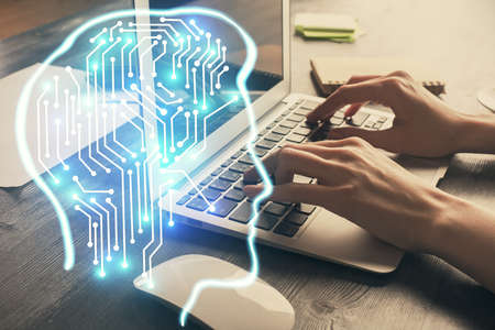 Multi exposure of woman hands working on computer and brain hologram drawing. Ai concept.