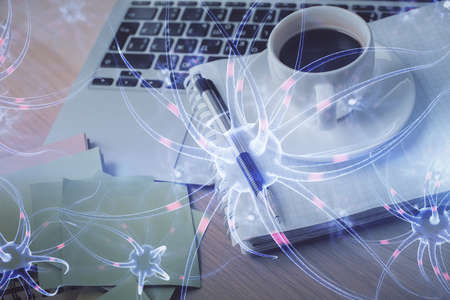 Double exposure of neuron drawing and desktop with coffee and items on table background. Concept of...