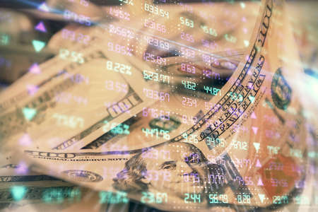 Double exposure of forex graph drawing over us dollars bill background. Concept of financial...