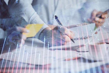 Double exposure of forex graph drawing over people taking notes background. Concept of financial...