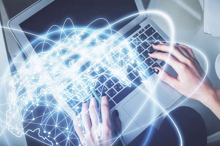 Double exposure of woman hands working on computer and financial theme hologram drawing. Top View....