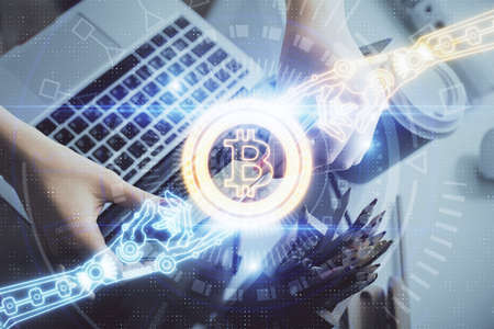 Double exposure of woman hands typing on computer and crypto market theme hologram drawing....