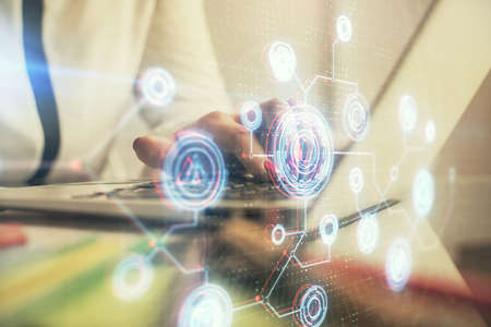 Multi exposure of woman hands working on computer and data theme hologram drawing. Tech concept.