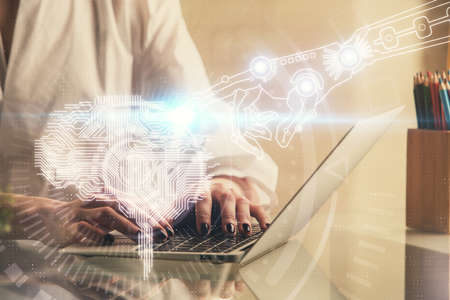 Double exposure of woman hands working on computer and brain hologram drawing. Ai concept.
