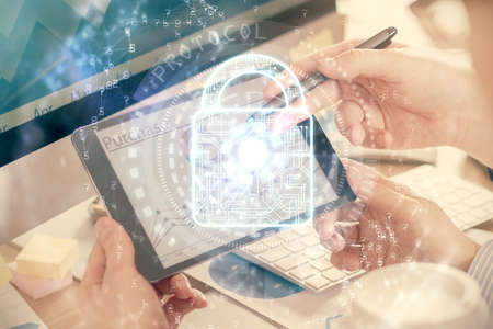Multi exposure of mans hands holding and using a digital device and lock drawing. Security concept.