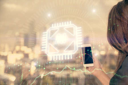 Double exposure of technology sketch hologram and woman holding and using a mobile device.
