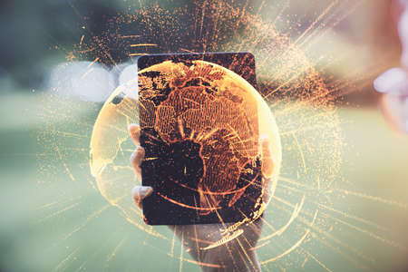 Double exposure of social network sketch hologram and woman holding and using a mobile device.の写真素材