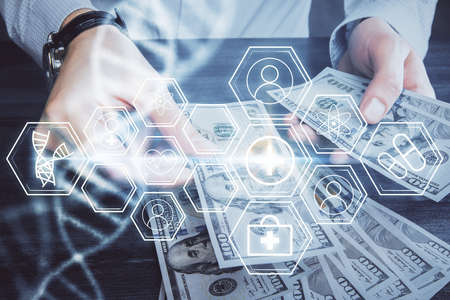 Multi exposure of dna drawing hologram and USA dollars bills and man hands. Medical education concept.の写真素材