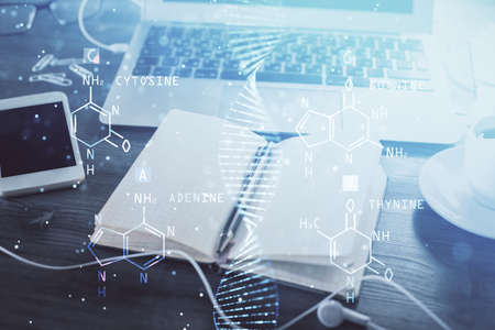 Double exposure of DNA drawing and desk with open notebook background. Concept of education