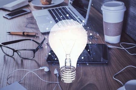 Double exposure of bulb drawing and cell phone background. Concept of ideaの写真素材