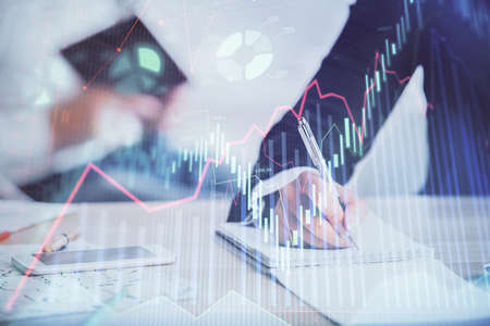 Double exposure of forex chart drawing over people taking notes background. Concept of financial...