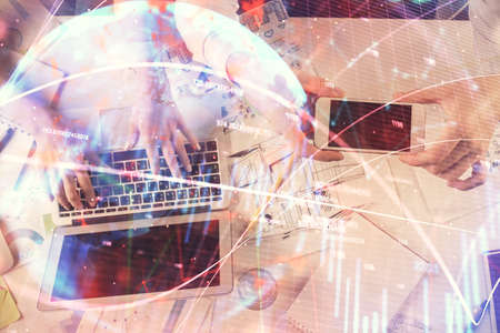 Multi exposure of man and woman working together and forex graph hologram drawing. Financial analysis concept. Computer background. Top View.の写真素材