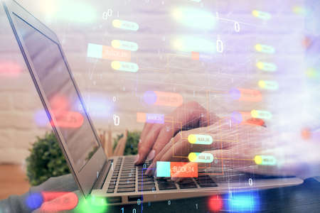 Double exposure of woman hands working on computer and data theme hologram drawing. Tech concept.