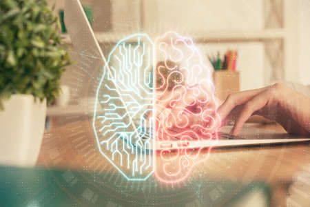 Double exposure of woman hands working on computer and brain hologram drawing. Ai concept.の写真素材