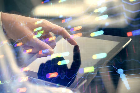 Multi exposure of mans hand holding and using a digital device and data theme drawing. Innovation concept.の写真素材