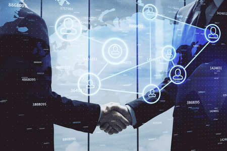 Double exposure of social network theme hologram and handshake of two men.の写真素材