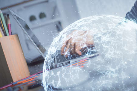 Double exposure of woman hands typing on computer and social network theme hologram drawing. People...