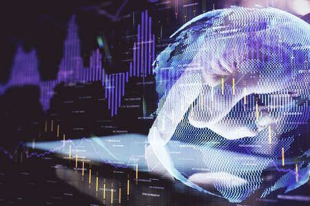 Double exposure of mans hands holding and using a digital device and forex graph drawing. Financial market concept.の写真素材