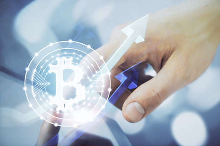 Double exposure of mans hands holding and using a phone and crypto currency blockchain theme drawing.の写真素材