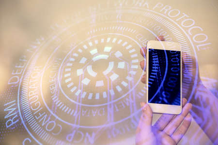 Double exposure of technology sketch hologram and woman holding and using a mobile device.の写真素材