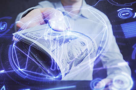 Multi exposure of education theme drawing hologram and USA dollars bills and man hands.の写真素材