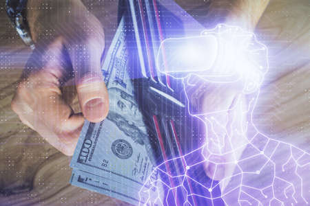 Multi exposure of vr glasses drawing hologram and USA dollars bills and man hands.の写真素材