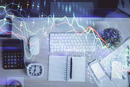 Multi exposure of forex graph drawing over desktop background with computer. Concept of financial...