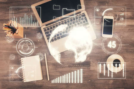 Double exposure of forex chart drawing over table background with computer. Concept of financial...