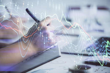 Double exposure of forex graph drawing over people taking notes background. Concept of financial analysisの写真素材