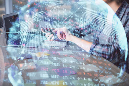 Multi exposure of woman hands typing on computer and business theme hologram drawing. Success concept.の写真素材