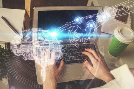 Double exposure of woman hands working on computer and brain hologram drawing. Ai concept.の写真素材