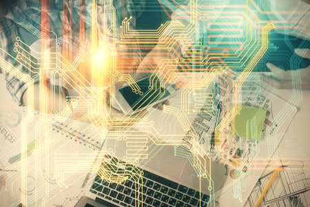 Double exposure of map drawing and man and woman working together holding and using a mobile device. Planet tech concept.の写真素材