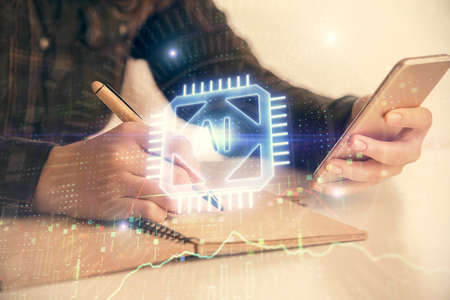 Double exposure of technology sketch hologram and woman holding and using a mobile device.