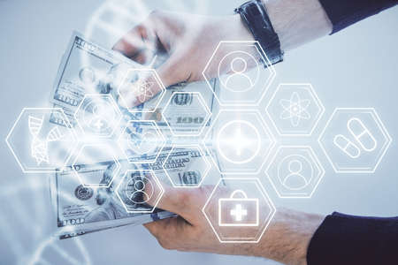 Multi exposure of dna drawing hologram and USA dollars bills and man hands. Medical education concept.の写真素材