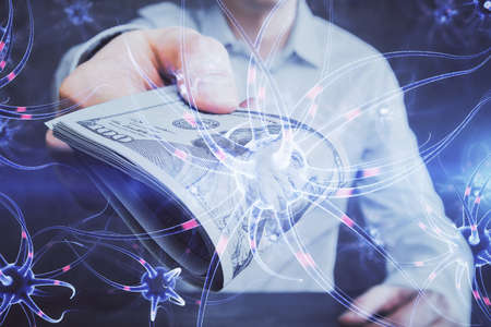Multi exposure of neuron drawing hologram and USA dollars bills and man hands. Educationの写真素材