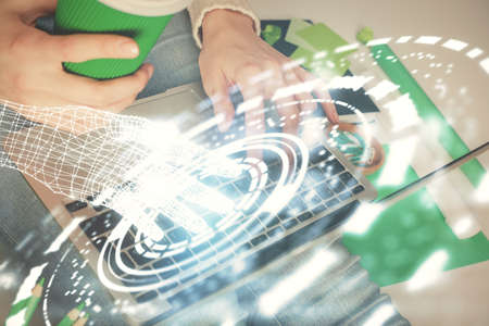 Double exposure of woman hands working on computer and data theme hologram drawing. Tech concept.