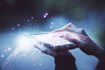 Double exposure of social network sketch hologram and woman holding and using a mobile device.