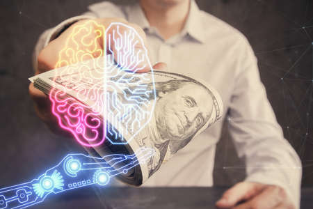 Multi exposure of brain drawing hologram and us dollars bills and man hands. Ai invest conceptの写真素材