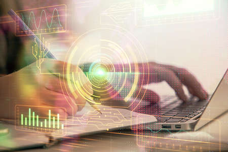 Multi exposure of woman hands working on computer and data theme hologram drawing. Tech concept.の写真素材