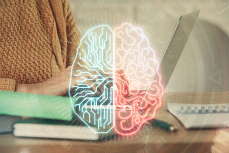 Multi exposure of woman hands working on computer and brain hologram drawing. Ai concept.の写真素材