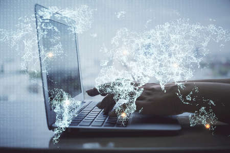 Double exposure of woman hands typing on computer and social network theme hologram drawing. People media concept.の写真素材