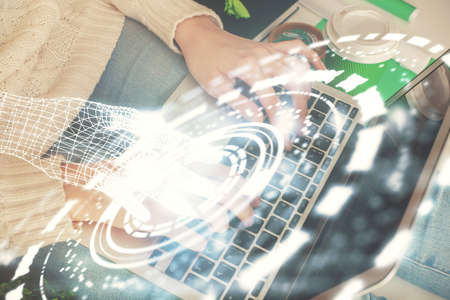 Double exposure of woman hands working on computer and data theme hologram drawing. Tech concept.