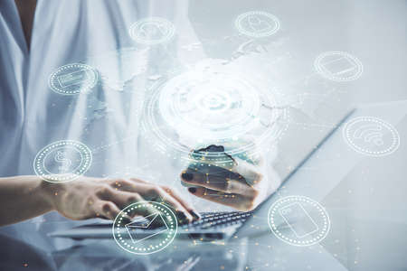 Double exposure of social network sketch hologram and woman holding and using a mobile device.の写真素材