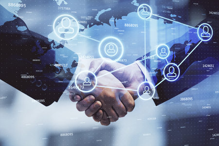 Double exposure of social network theme hologram and handshake of two men.の写真素材