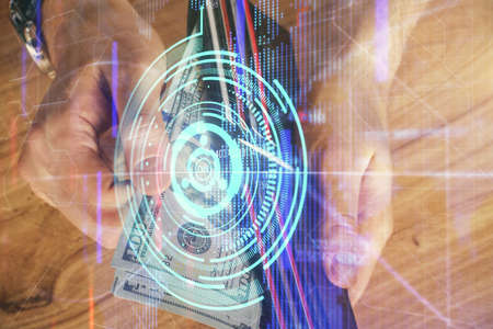 Double exposure of technology drawing hologram and us dollars bills and man hands. Data conceptの写真素材