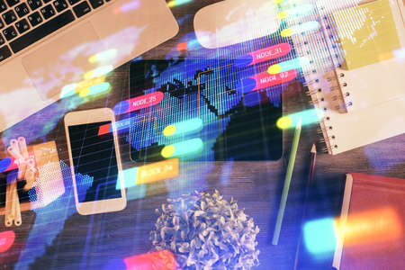 Double exposure of technology theme drawing over work table desktop. Top view. Global data analysis concept.の写真素材