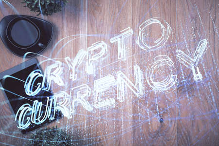 Double exposure of blockchain theme hologram over table with phone. Top view. Crypto technology concept.の写真素材