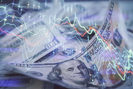 Double exposure of forex graph drawing over us dollars bill background. Concept of financial markets.の写真素材