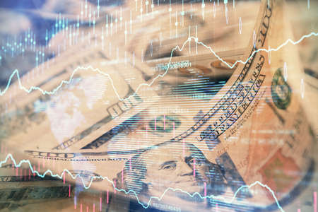 Double exposure of forex graph drawing over us dollars bill background. Concept of financial markets.の写真素材