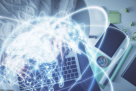Double exposure of woman hands working on computer and financial theme hologram drawing. Top View....
